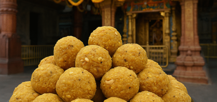 Freshly prepared Tirupati laddus stacked in temple kitchen
